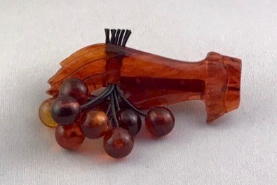BP253 rootbeer bakelite hand with cherries pin